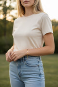 Gold bracelet with black hearts charm
