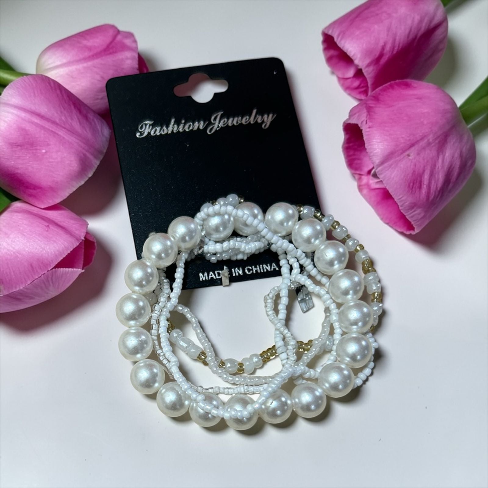 set of white bracelets
