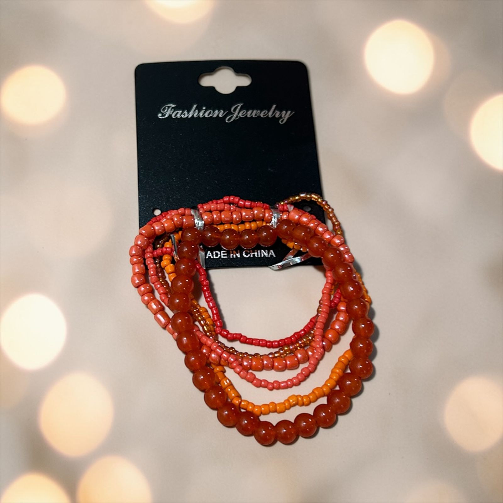set of orange bracelets