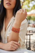 set of orange bracelets