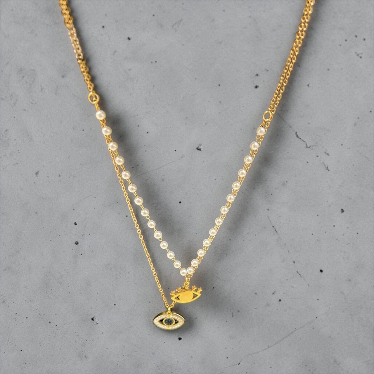 Gold necklace with eye charm