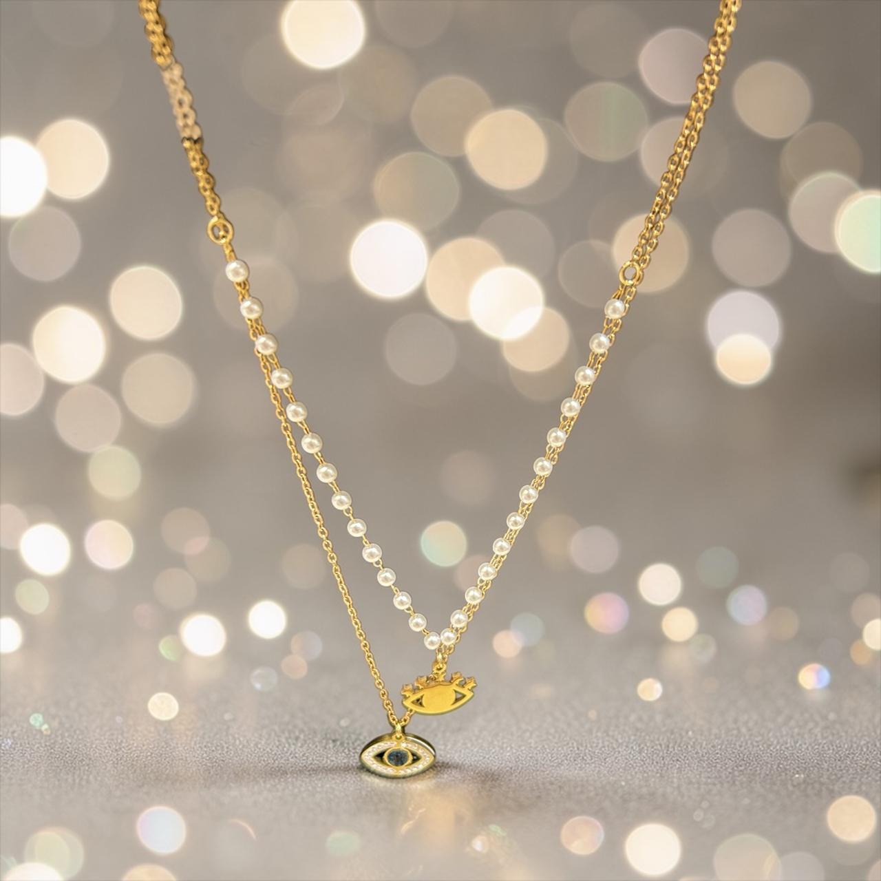 Gold necklace with eye charm