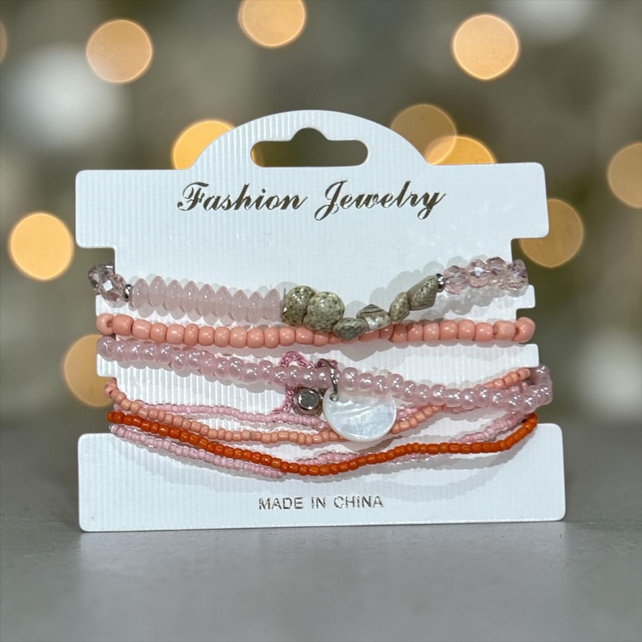 Set of pink and white bracelets
