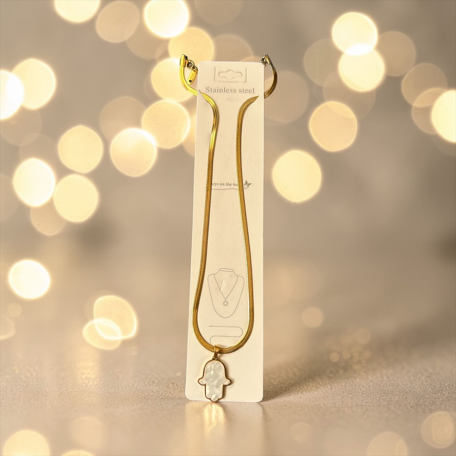 Elegant Gold snake back necklace with hand palm charm