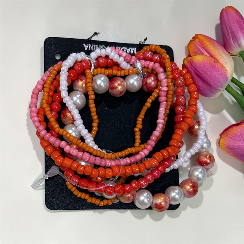 set of orange handmade bracelets