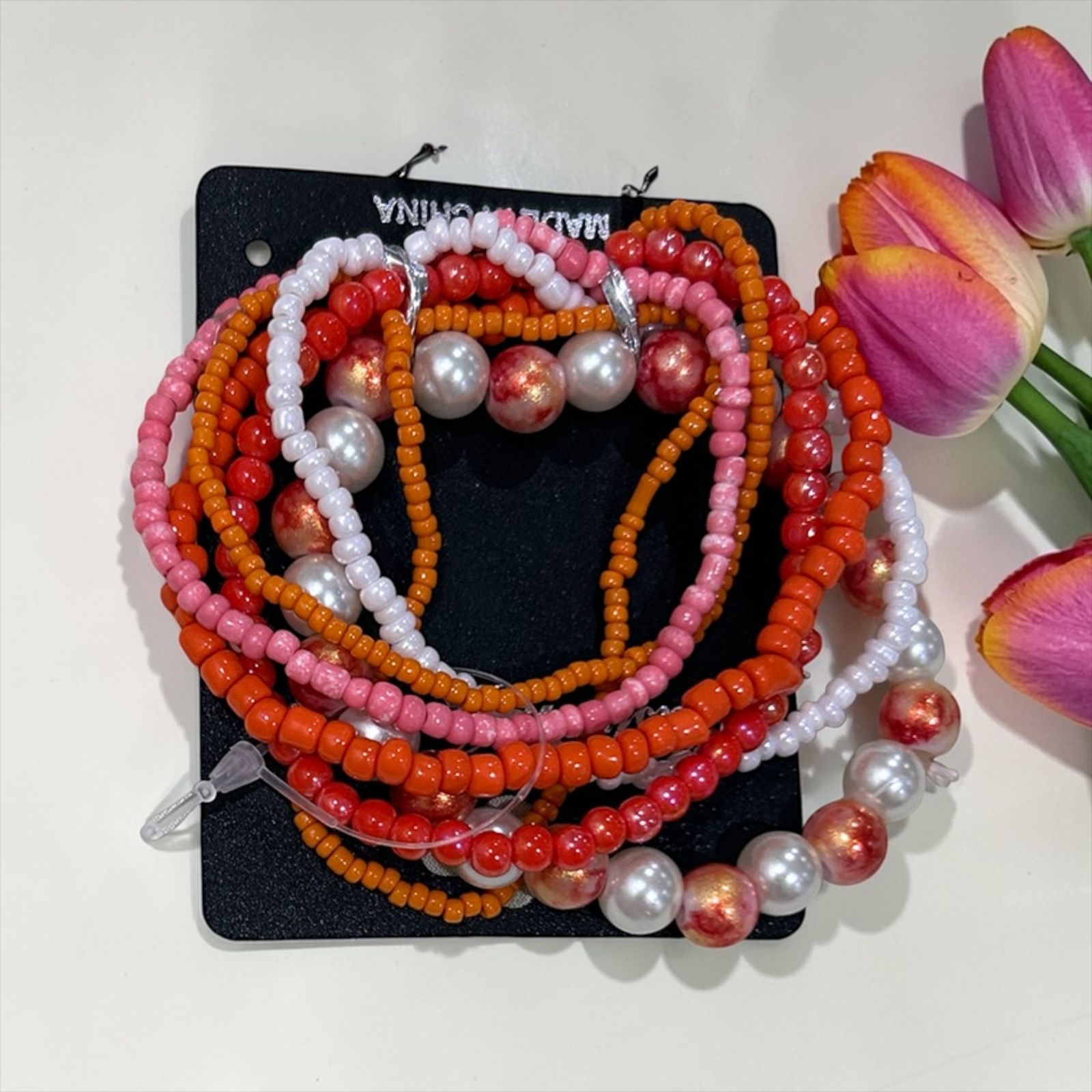 set of orange handmade bracelets
